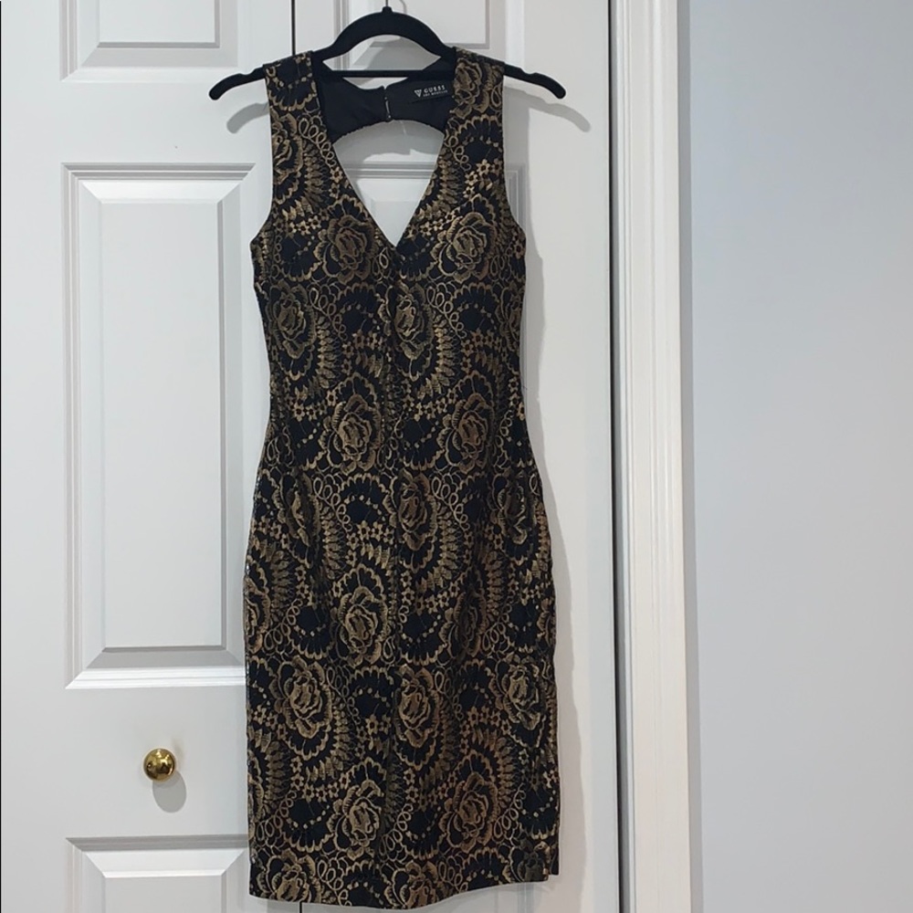 Gorgeous black and gold open back dress